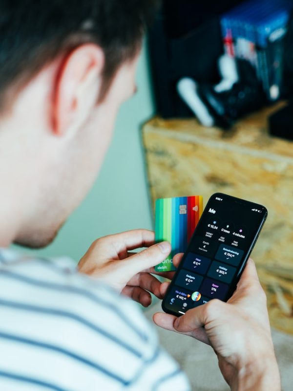 person holding black remote control